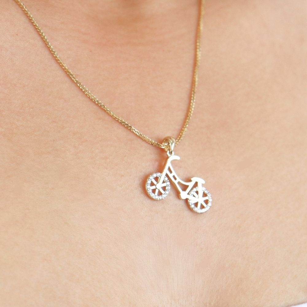 Dije de Oro 14k con Forma de Bicicleta Fina Incrustada con Zirconias mod. 4648