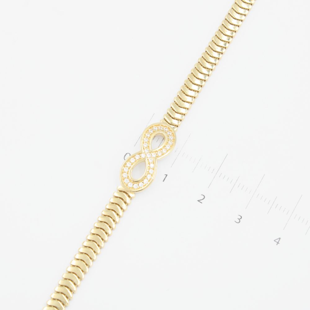Pulsera de Oro 14k Diseño de Serpiente Flexible con Infinito Incrustado de Zirconia mod. 9259