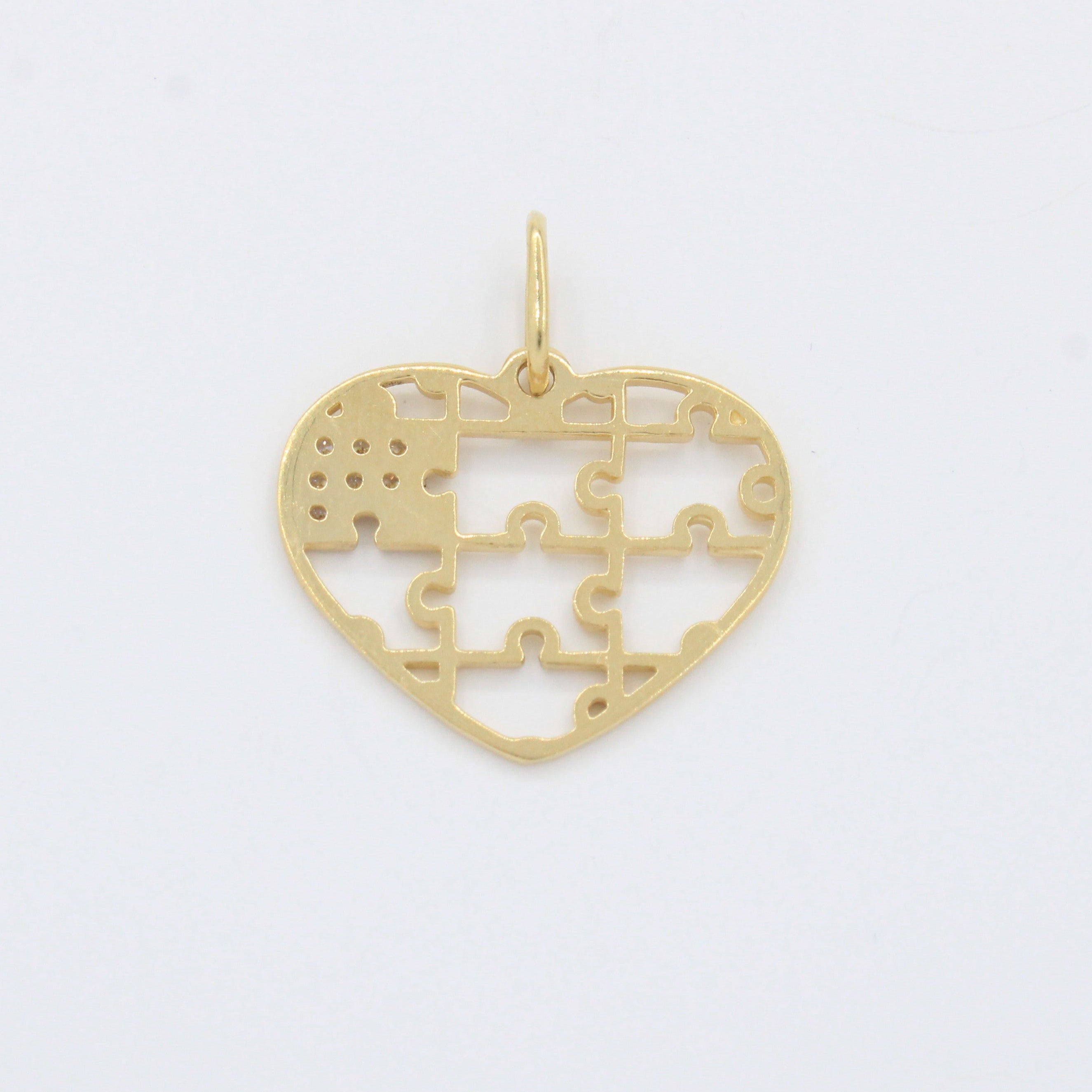 Dije de Oro 14k Corazón Rompecabeza con Pieza de Zirconias Finas mod. 10515