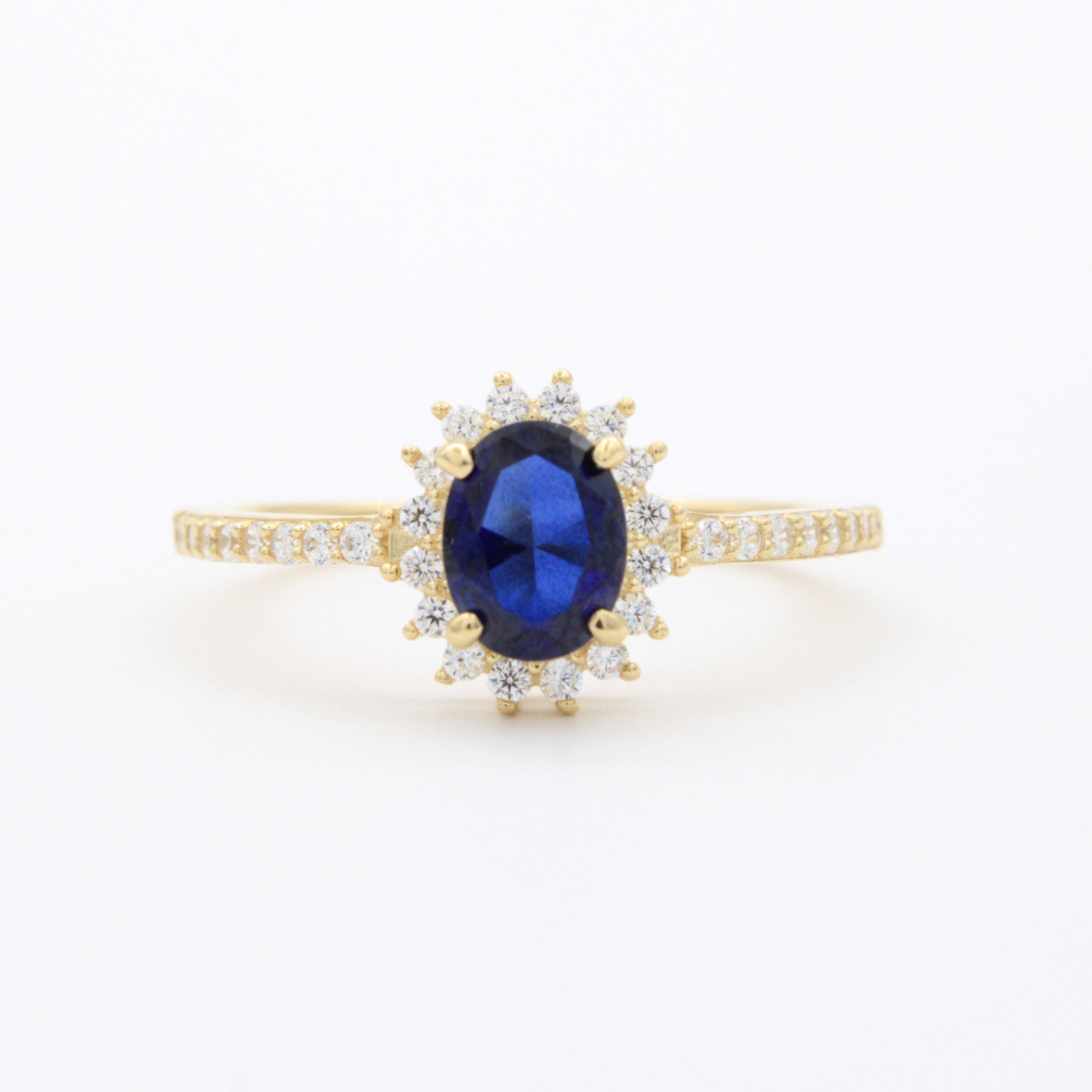 Anillo de Oro 14k Diseño Elegante con Zirconias Finas y Zirconia Color Azul Profundo mod. 10750