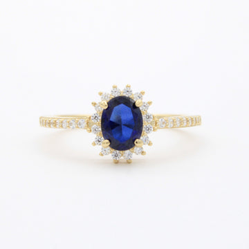 Anillo de Oro 14k Diseño Elegante con Zirconias Finas y Zirconia Color Azul Profundo mod. 10750