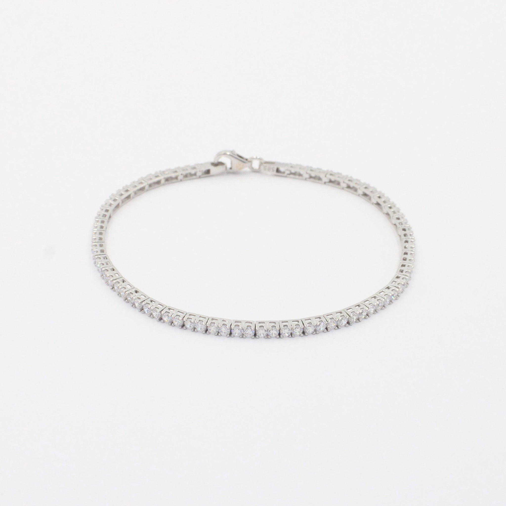 Pulsera de Oro Blanco 14k con Engaste de 4 Garras de Zirconias Redondas mod. 9996