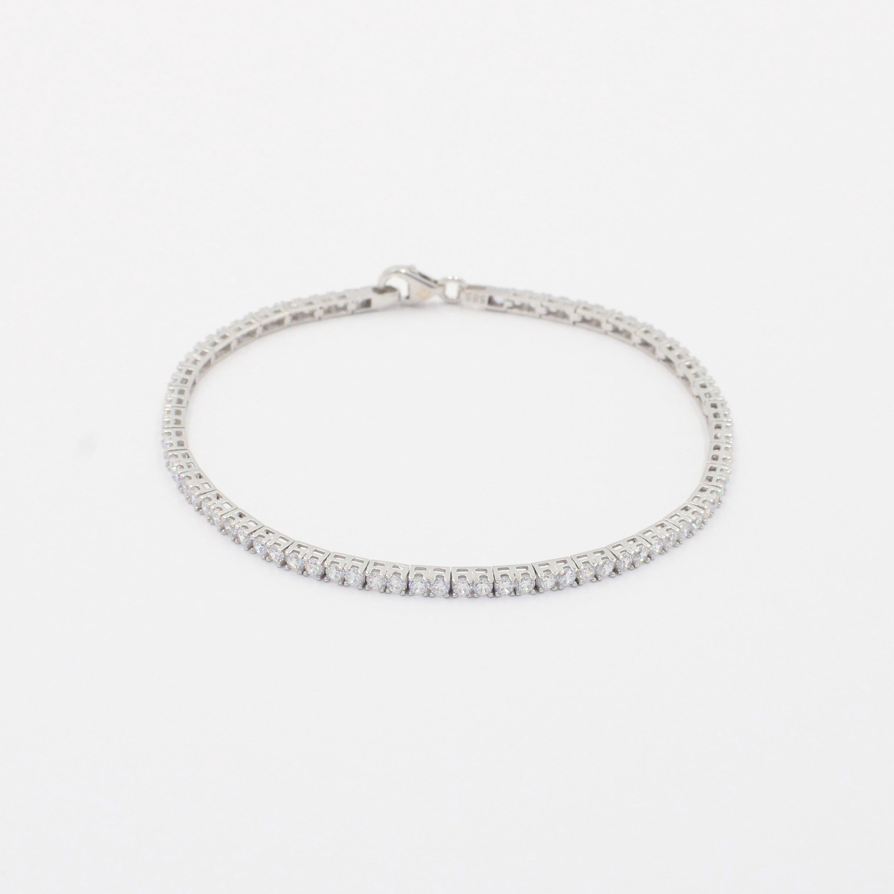 Pulsera de Oro Blanco 14k con Engaste de 4 Garras de Zirconias Redondas mod. 9996