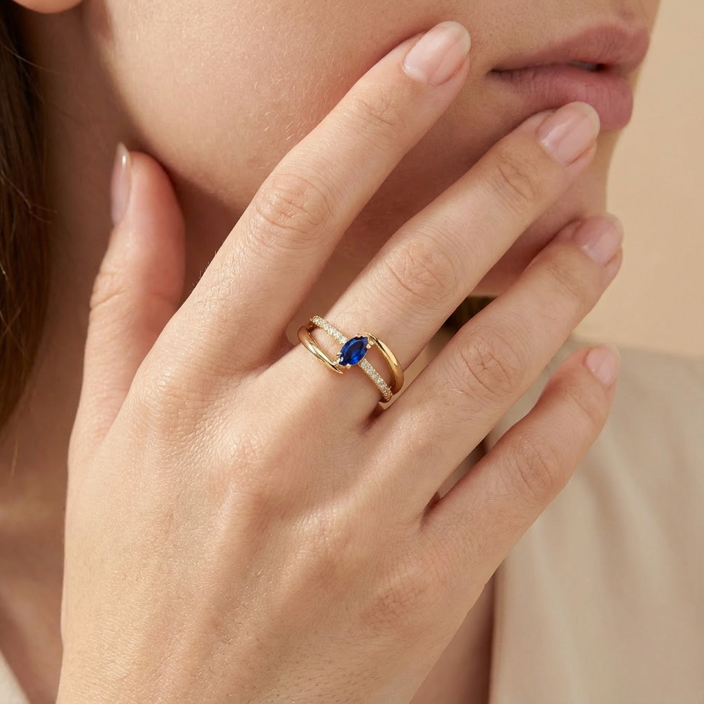 Anillo de Oro 14k Diseño Cruzado con Zirconia Azul Oval y Carril de Zirconias mod. 10390