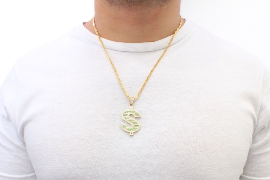 Dije Especial Signo de Pesos Incrustado con Zirconias Verdes y Blancas mod. 6137